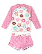 Girls pink donut printed swimsuit set with long sleeve rash guard top and matching shorts, playful summer swimwear for kids.