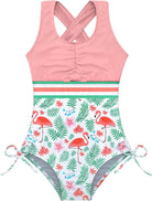 Girls pink flamingo one piece swimsuit with cross back straps, printed design and stretch fabric for beach and pool activities.