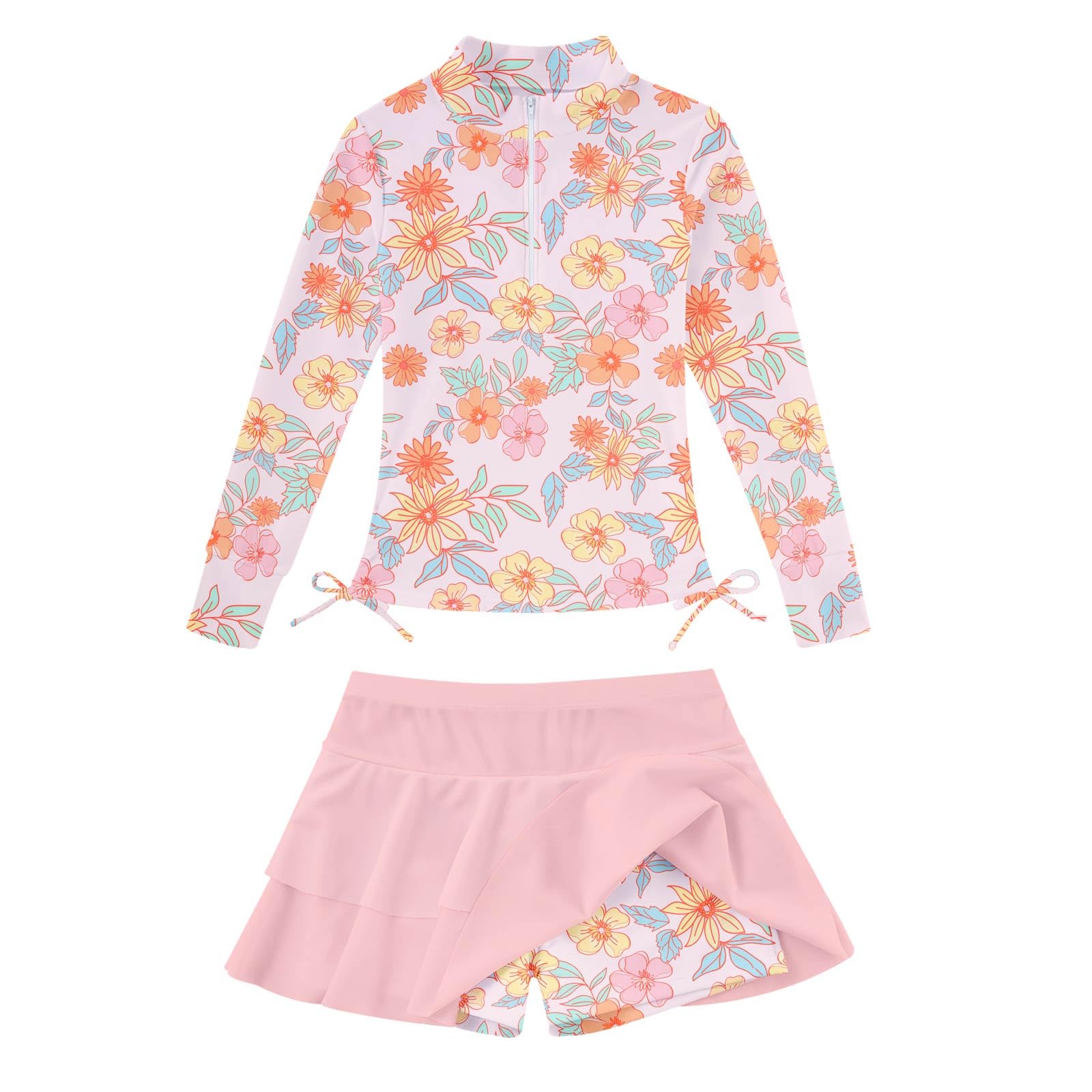 Girls pink floral long sleeve rash guard swimsuit set with skirted swim bottoms, cute printed beach swimwear for summer vacations.