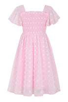 Girls pink chiffon dress with Swiss dot texture and ruffle details, cute party outfit for birthdays and celebrations.