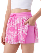 Girls pink tropical print athletic shorts with drawstring waist and flexible fit for sports and everyday wear.