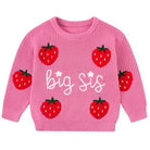 Girls raspberry pink knit sweater with Big Sis lettering and strawberry designs, a cozy sibling-themed top for fall and winter wear.