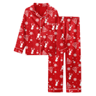 Girls red elk Christmas pajama set featuring holiday reindeer print, matching long pants and comfortable fabric for winter nights.