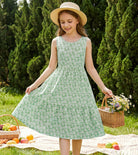 Girl wearing a colorful summer sundress while playing outdoors, comfortable lightweight outfit for warm weather.