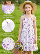 Close up of girls sundress set showing floral print, adjustable straps and matching T-shirt top design.