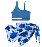Girls Tropical Bloom three piece swimsuit featuring colorful floral patterns and a matching wrap skirt.