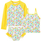 Girls yellow floral tankini swim set with long sleeve rash guard and ruffle shorts, bright kids swimwear for summer.