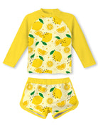 Girls yellow lemon print swim set with long sleeve rash guard top and shorts, bright fruit pattern swimwear for summer.