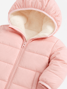 Close-up of a pink hooded puffer jacket showing the soft fleece-lined hood, quilted construction and full front zipper.