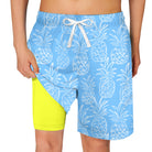 light blue pineapple print boys swim trunks with neon yellow compression liner and drawstring waist