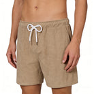 Man wearing linen blend shorts showing relaxed fit, drawstring waistband and comfortable summer casual style.