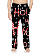 Men's black pajama pants with bold festive holiday text graphics and relaxed full-length fit for casual lounging and seasonal home wear.