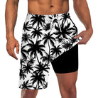 Men's black palm leaf print 2-in-1 swim trunks with built-in compression liner for swimming, pools and summer travel.