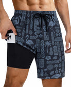Men's black printed swim trunks with modern resort wear design
