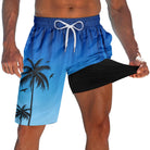 Men's blue palm tree 2-in-1 swim trunks with black compression liner and adjustable drawstring waist for beach, pool and summer wear.