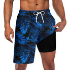Men's bright blue leaf print swim trunks with black compression liner and drawstring waist for comfortable beach and pool wear.