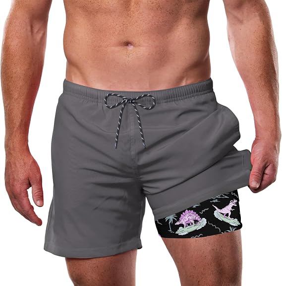 Men's gray 2-in-1 swim trunks with drawstring waist and black tropical print compression liner, designed for swimming, beach and active summer wear.