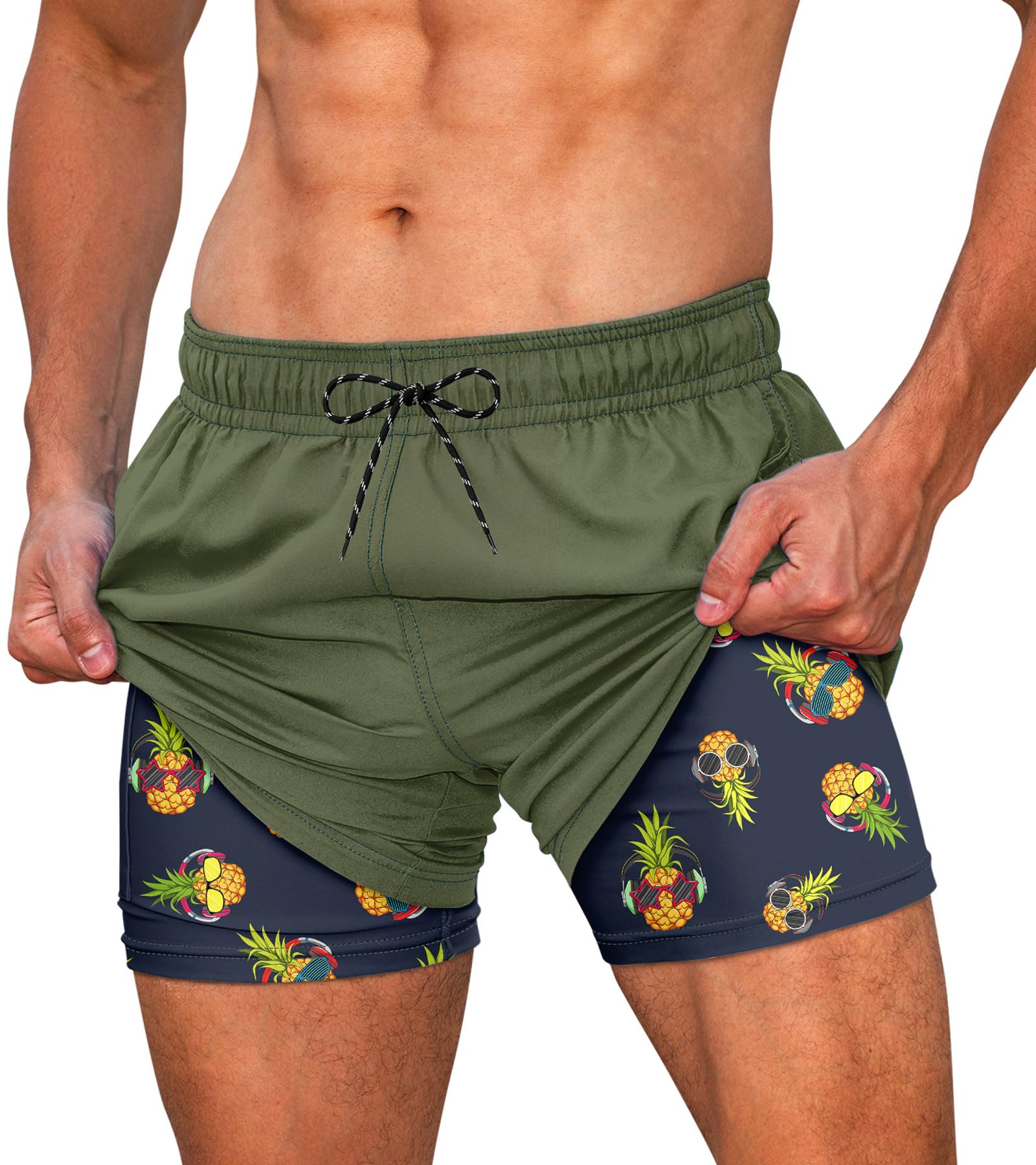 Men's green swim trunks with built-in compression liner and tropical inner shorts