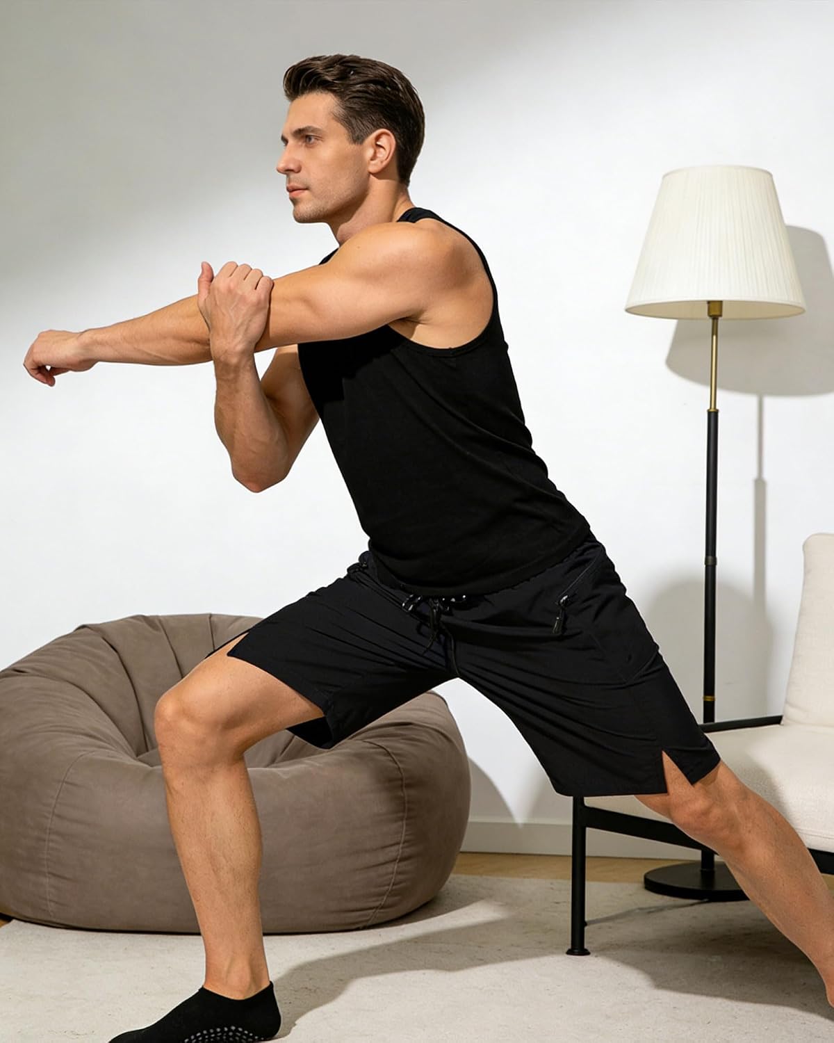 Man wearing AIDEALOOM workout shorts during strength training exercises.