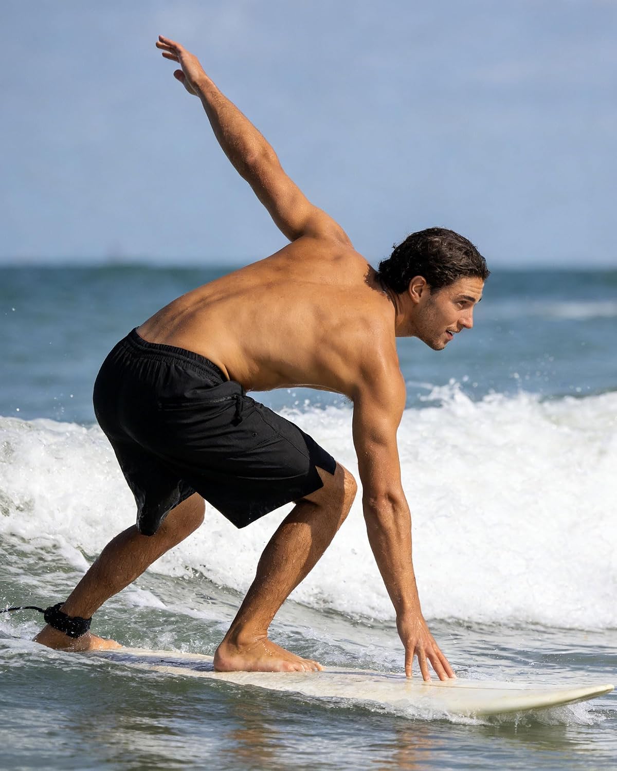 Man wearing lightweight 2-in-1 running shorts during outdoor training.