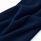 Close-up of boys navy polo shirt fabric showing the soft stretch texture and lightweight polyester spandex material.
