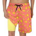 neon yellow banana print boys swim trunks with pink outer shorts and quick dry fabric