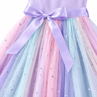 Close-up of the girls purple tulle dress showing the layered pastel skirt, soft mesh fabric and flowing tulle construction.