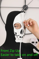 Close-up of kids skeleton costume showing the hooded head design, skull styling and stretch fabric construction.