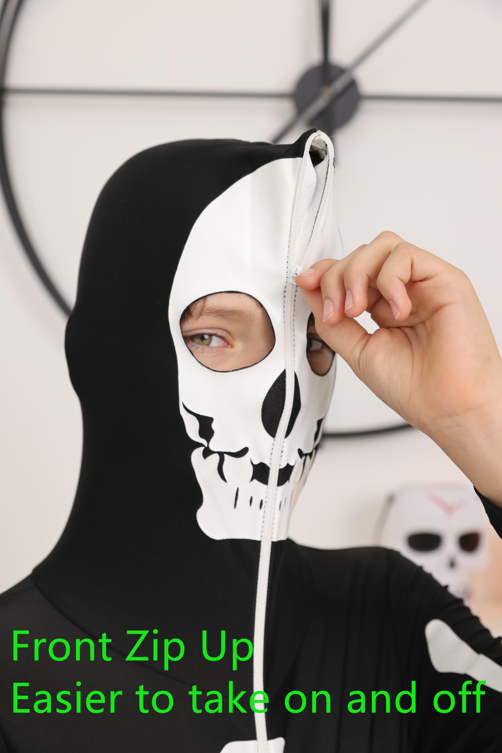Close-up of kids skeleton costume showing the hooded head design, skull styling and stretch fabric construction.