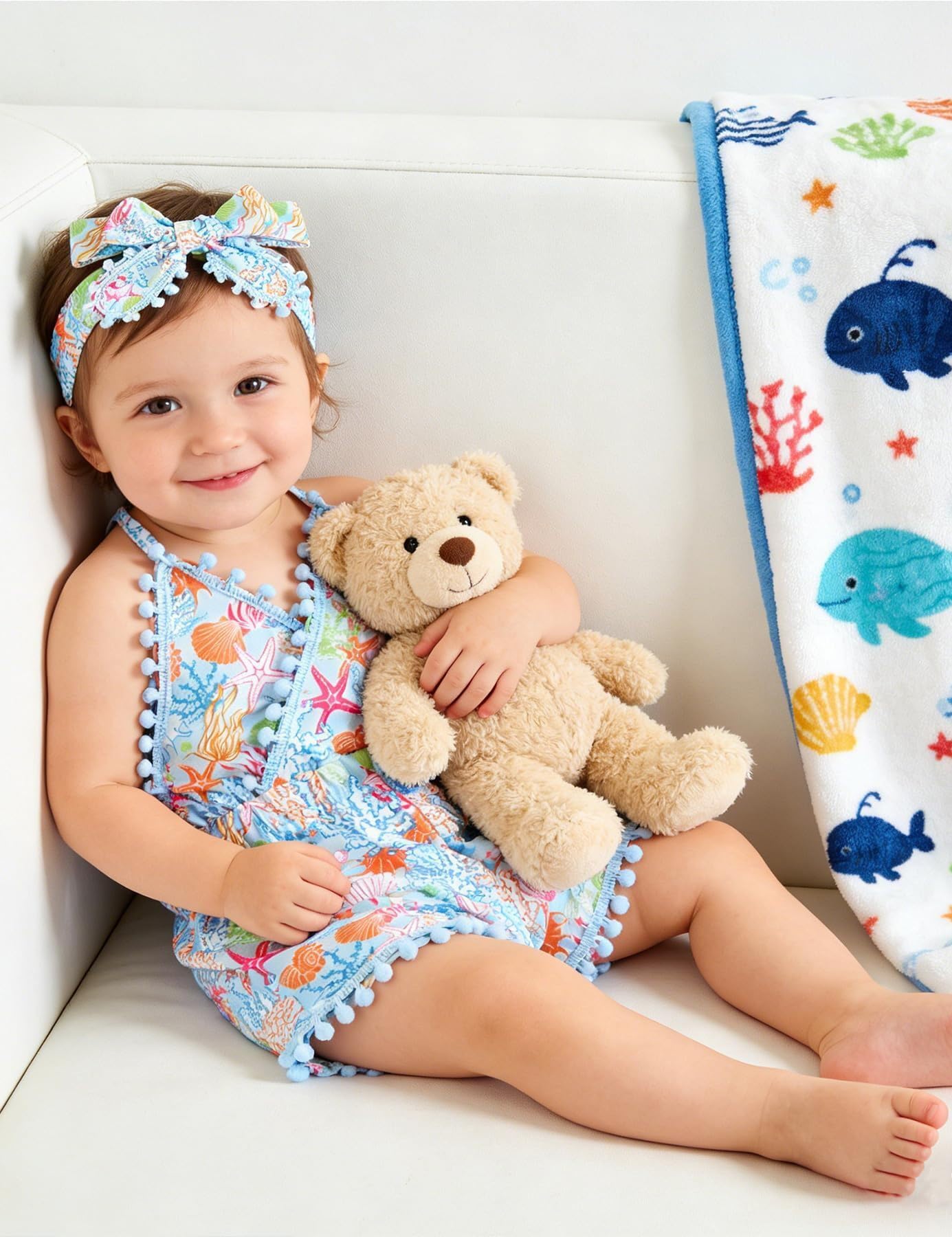Toddler girl wearing a colorful romper dress with headband, comfortable cotton blend outfit for summer days and family occasions.