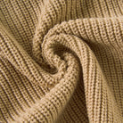 Close-up of the khaki toddler sweater showing the soft knitted texture and ribbed cotton blend fabric construction.