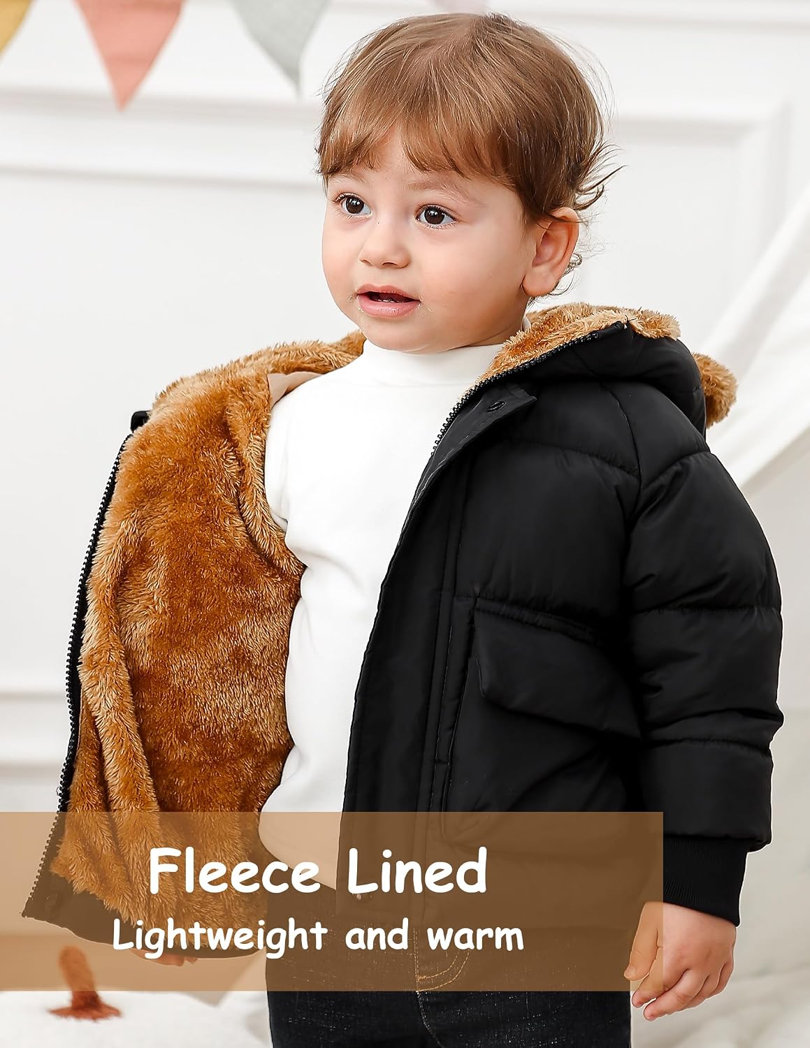 Toddler black puffer jacket shown open to display the soft brown fleece lining and cozy insulated interior for winter warmth.