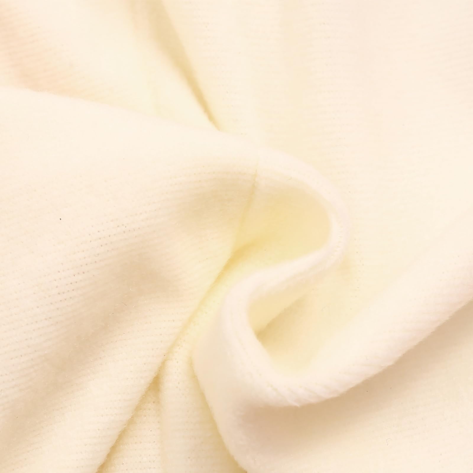 Close-up of the soft cream lining used inside the toddler puffer snowsuit, showing the cozy texture designed for winter comfort.