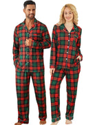 Couple wearing green and red plaid Christmas pajamas with matching long sleeve tops and pants